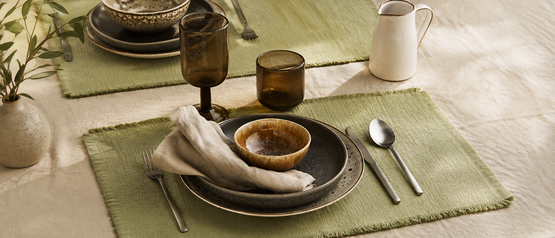 Relaxed table setting with ceramic tableware and natural linen