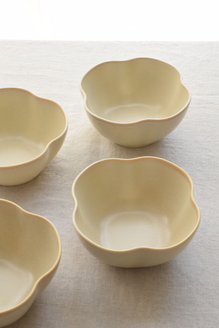 Serving bowls arranged on a relaxed dining table